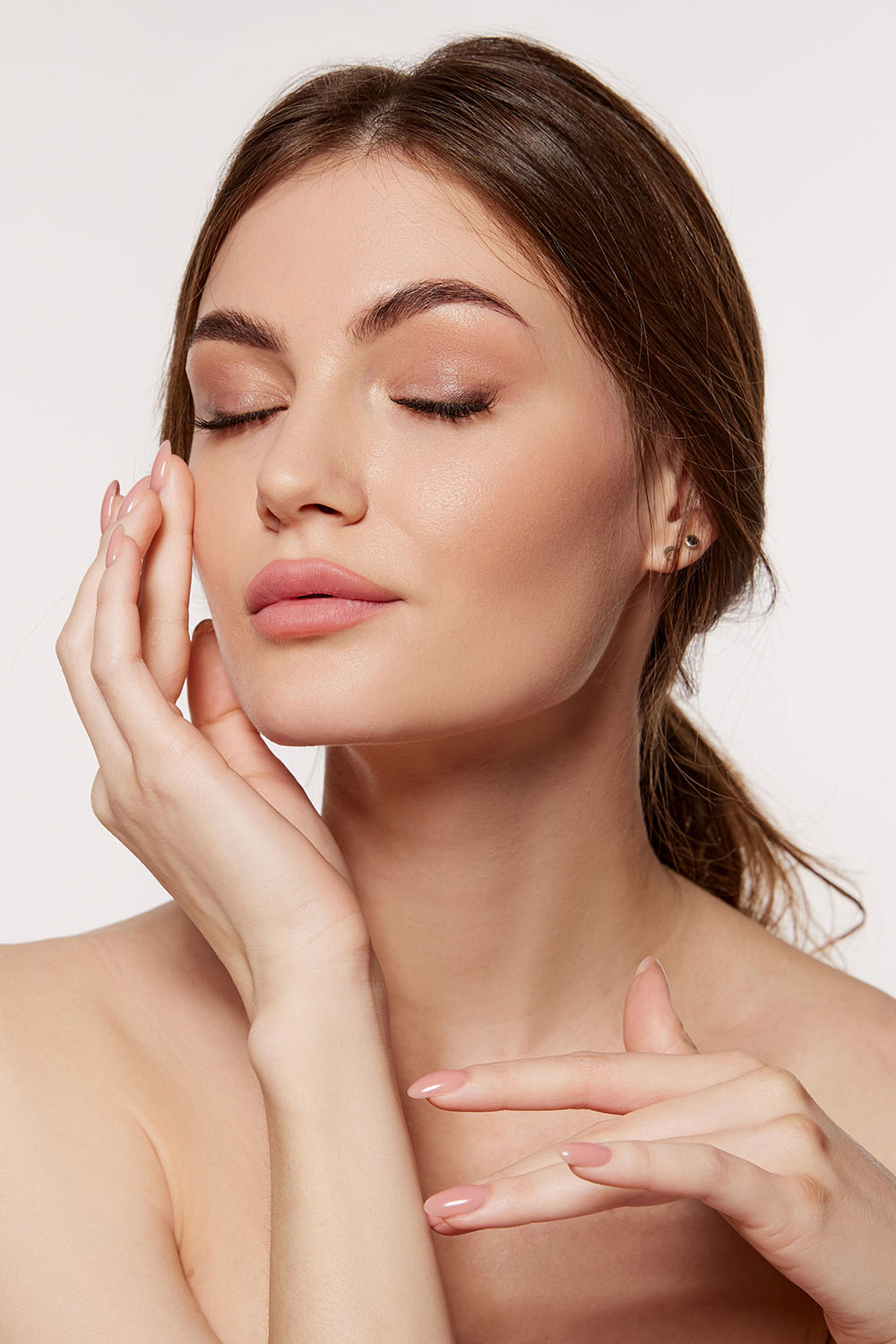 woman touching cheek