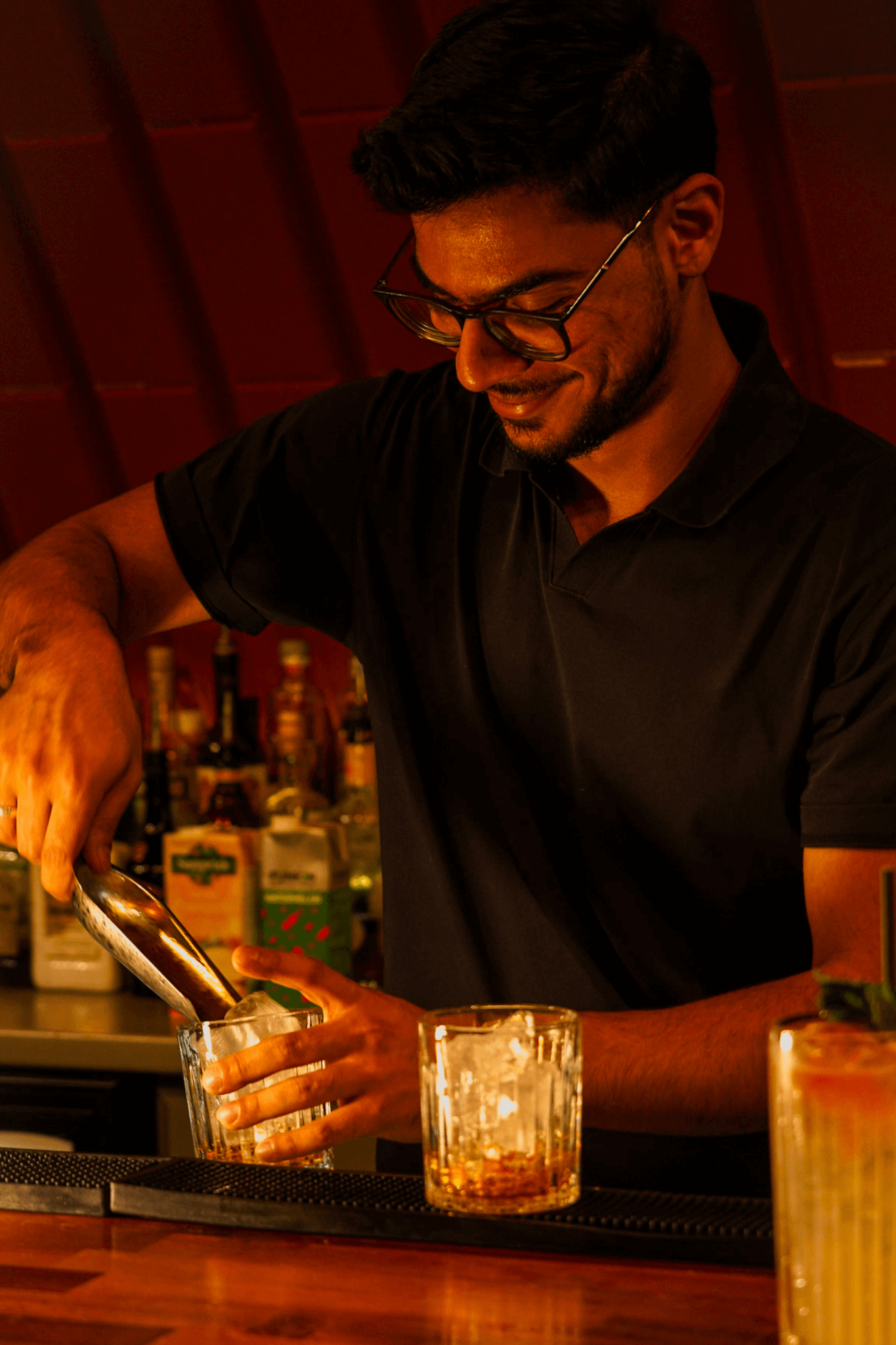 Bartender pouring drink during happy hour promotion