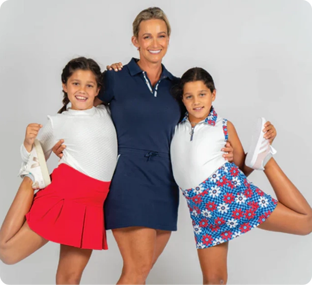 Hannah, founder of Marie Birdie, with two young golfers