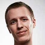 A man poses for the camera on a white background