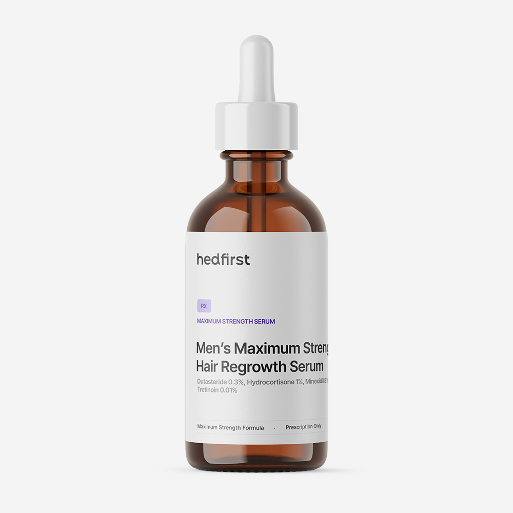 Amber dropper bottle labeled Hedfirst Men's Maximum Strength Hair Regrowth Serum with white label on white background.