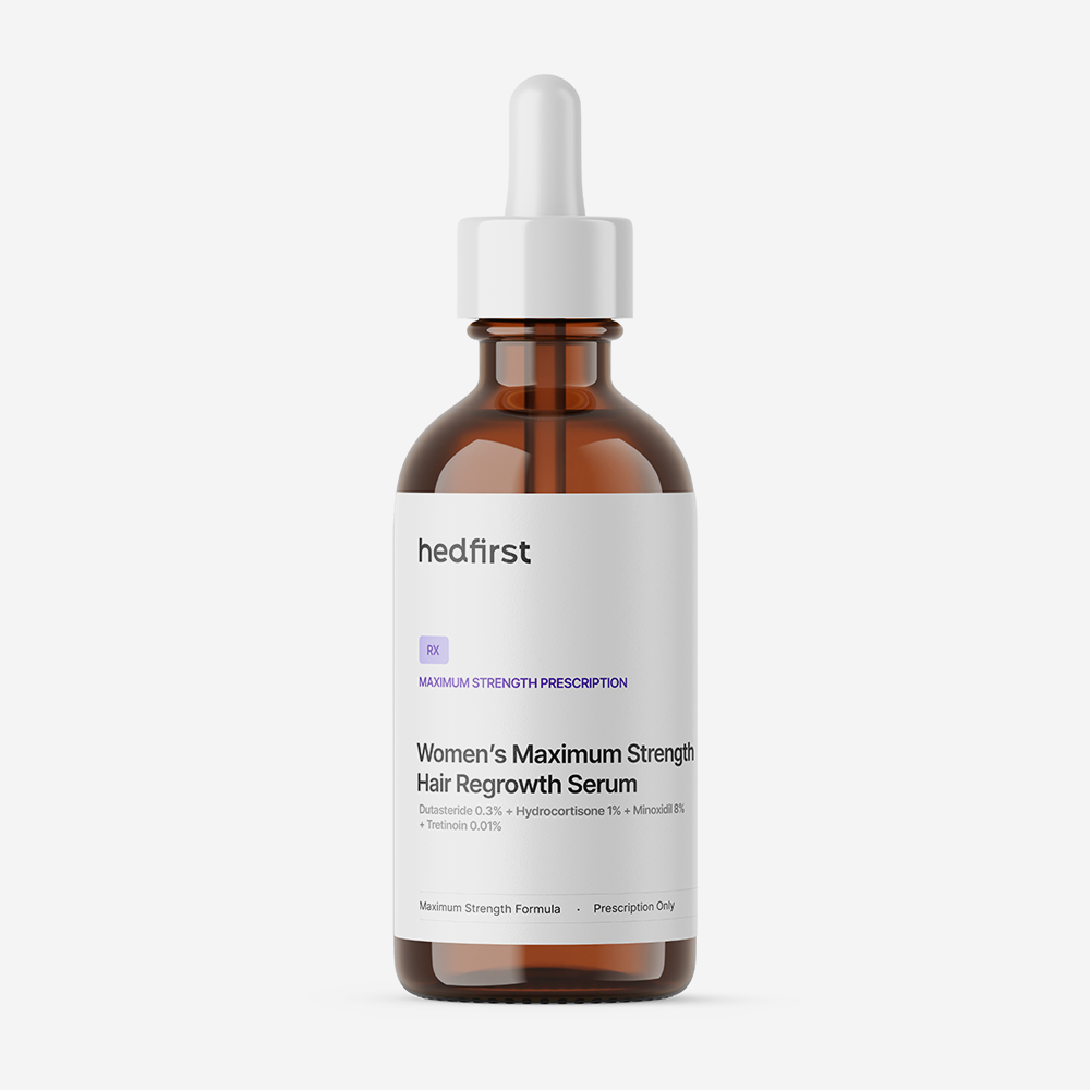 Amber dropper bottle with white label showing Hedfirst Women's Maximum Strength Hair Regrowth Serum on white background.