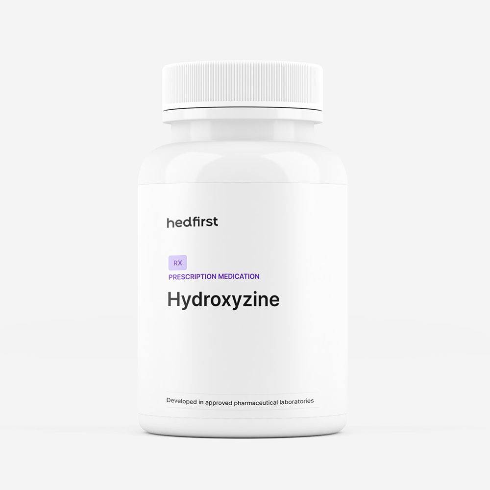White prescription medication bottle labeled Hydroxyzine for non-habit forming anxiety relief on white background.