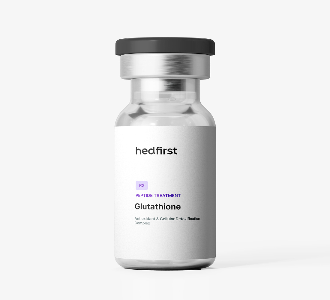 Small clear glass vial with black cap labeled Hedfirst Glutathione peptide treatment on white background.