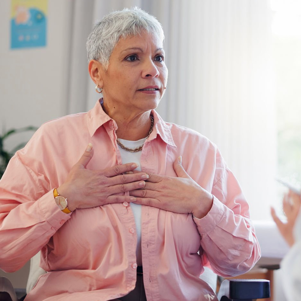 Woman describing heart palpitations during medical consultation.