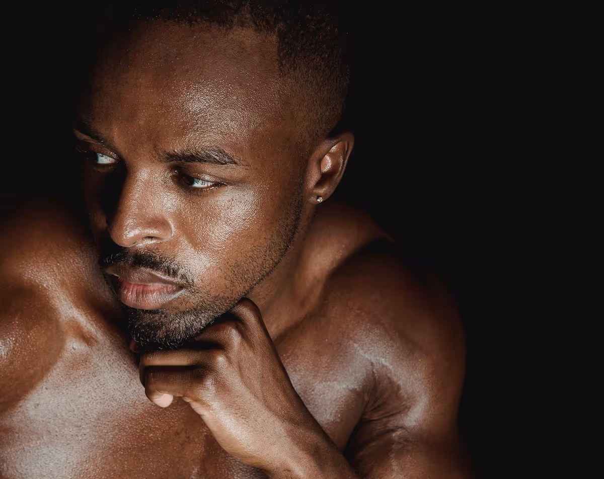 Confident man looking thoughtful, representing personalized erectile dysfunction treatment.