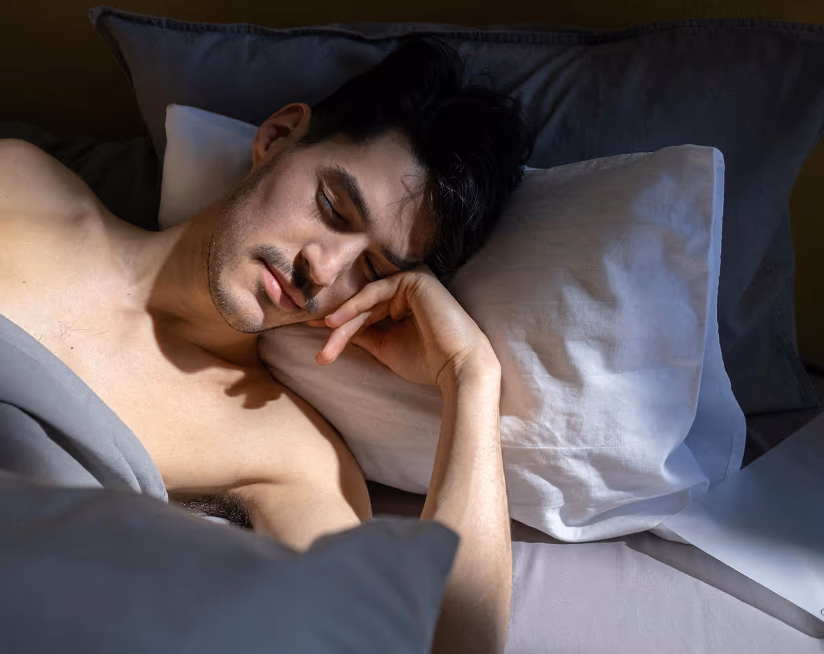 Man sleeping peacefully after successful premature ejaculation treatment.