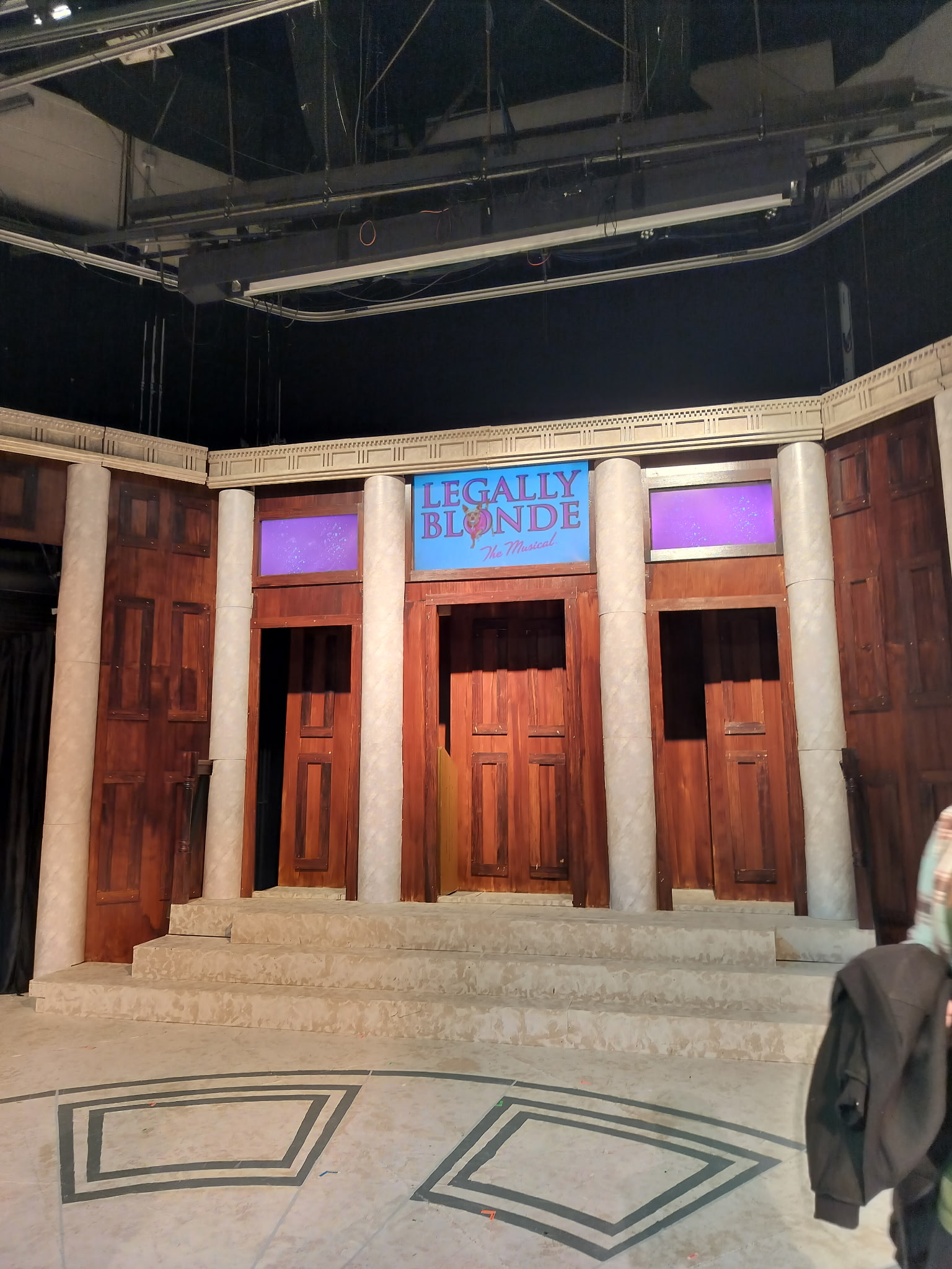 We had 5 TV's in the set, we covered all of them with a cyc material so they would not be visible during blackouts.