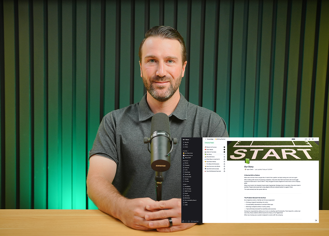 Smiling man in a gray polo shirt sitting at a wooden table with a microphone and a computer screen showing a 'START' graphic and text.