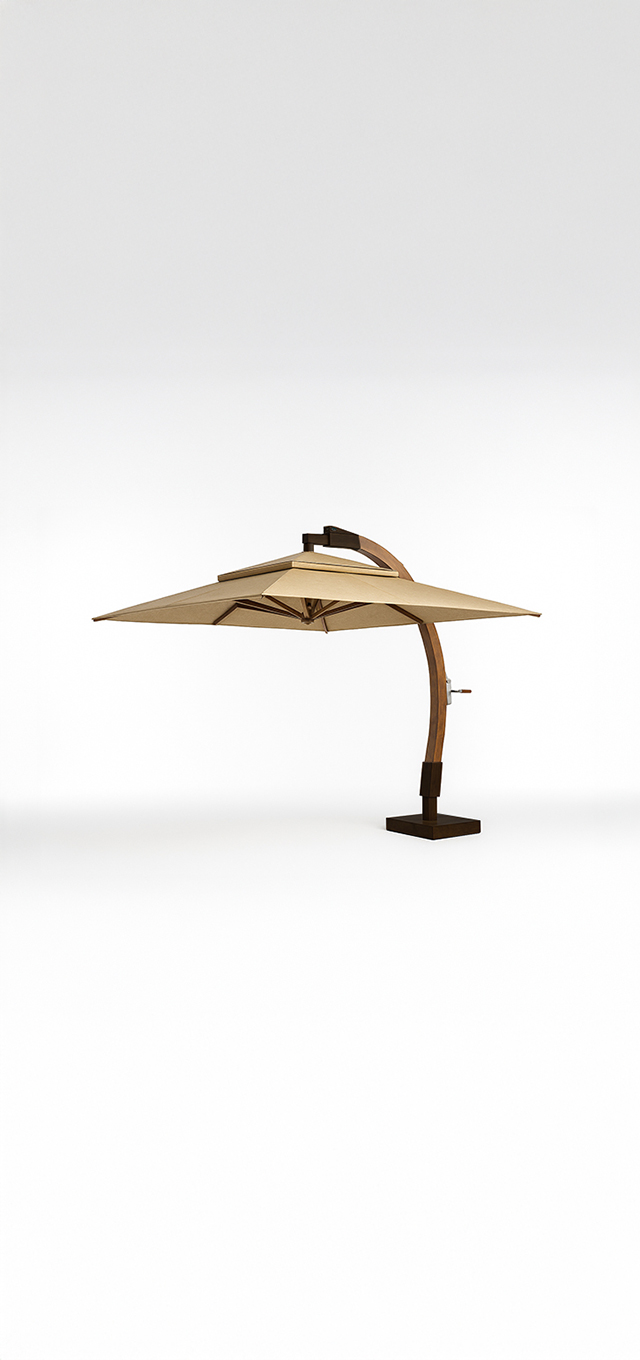 A large beige curved cantilever umbrella with a wooden stand rests on a square base.