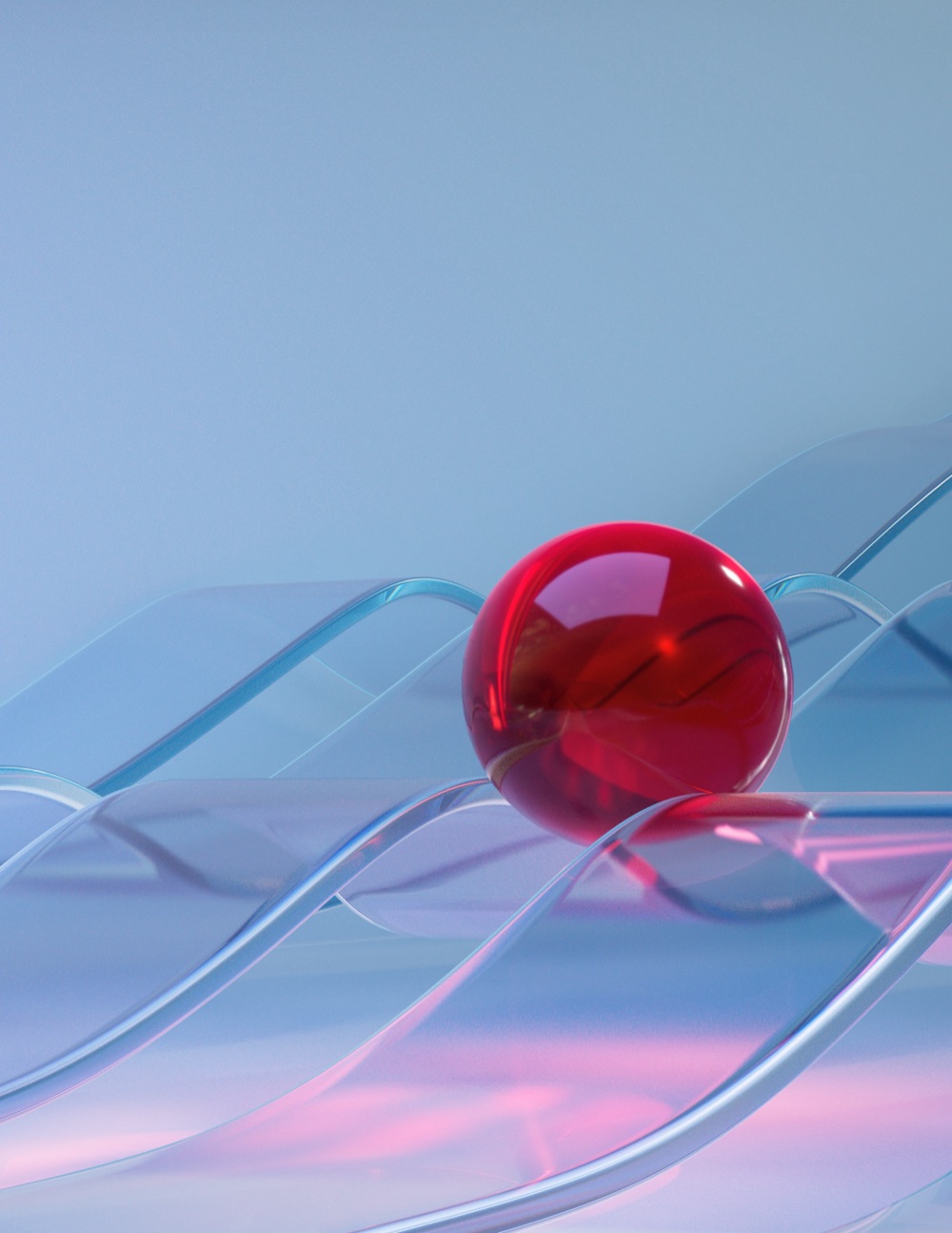 Red glass sphere resting on flowing glass ribbons
