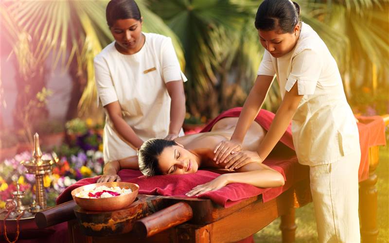 Guest and staff at Ananda in the Himalayas India wellness resort