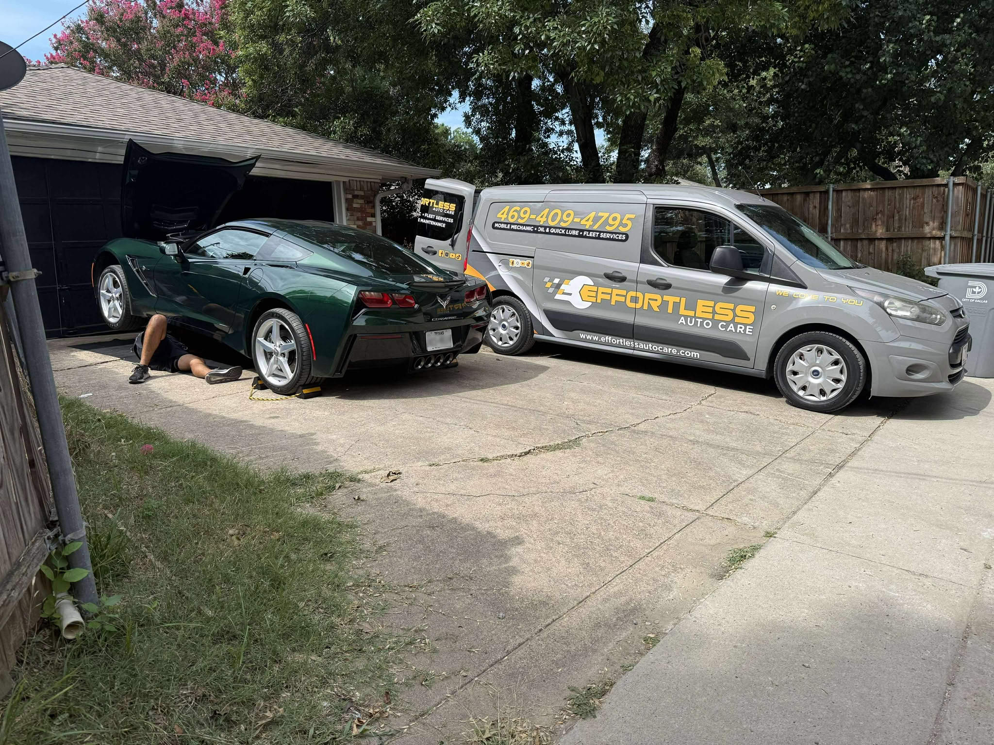 Mechanic working on green Corvette next to Effortless Auto Care van