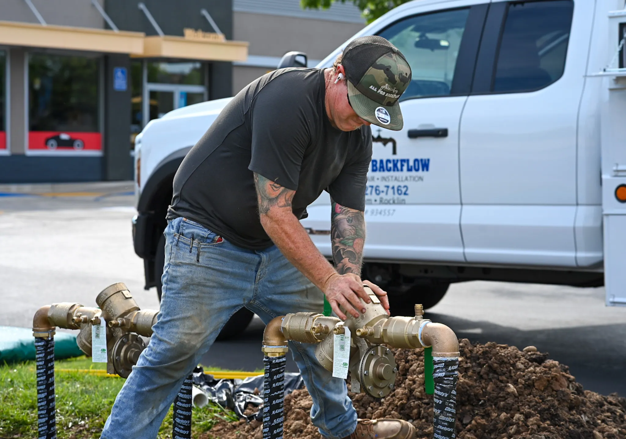 A man working in front of a pickup