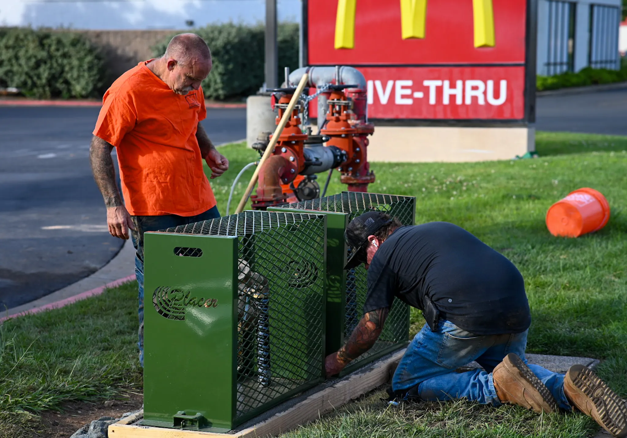 2 men inspecting a backflow setup