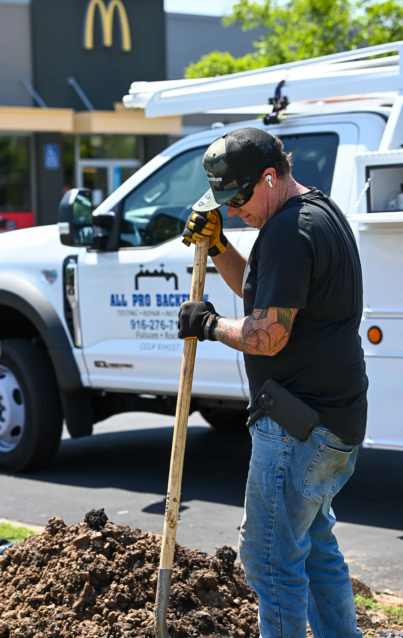A man working with a shovel