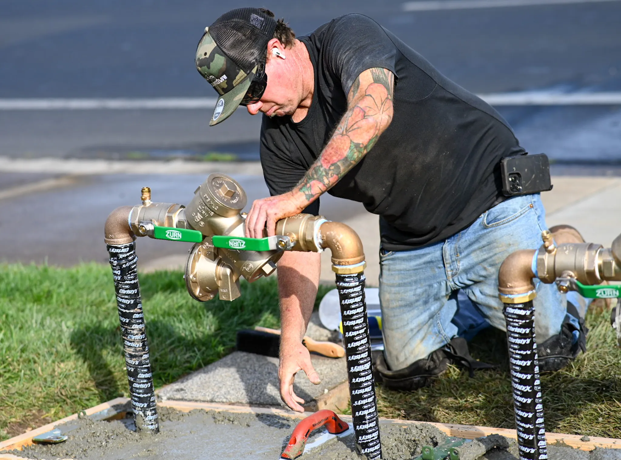 A man inspecting a backflow installation