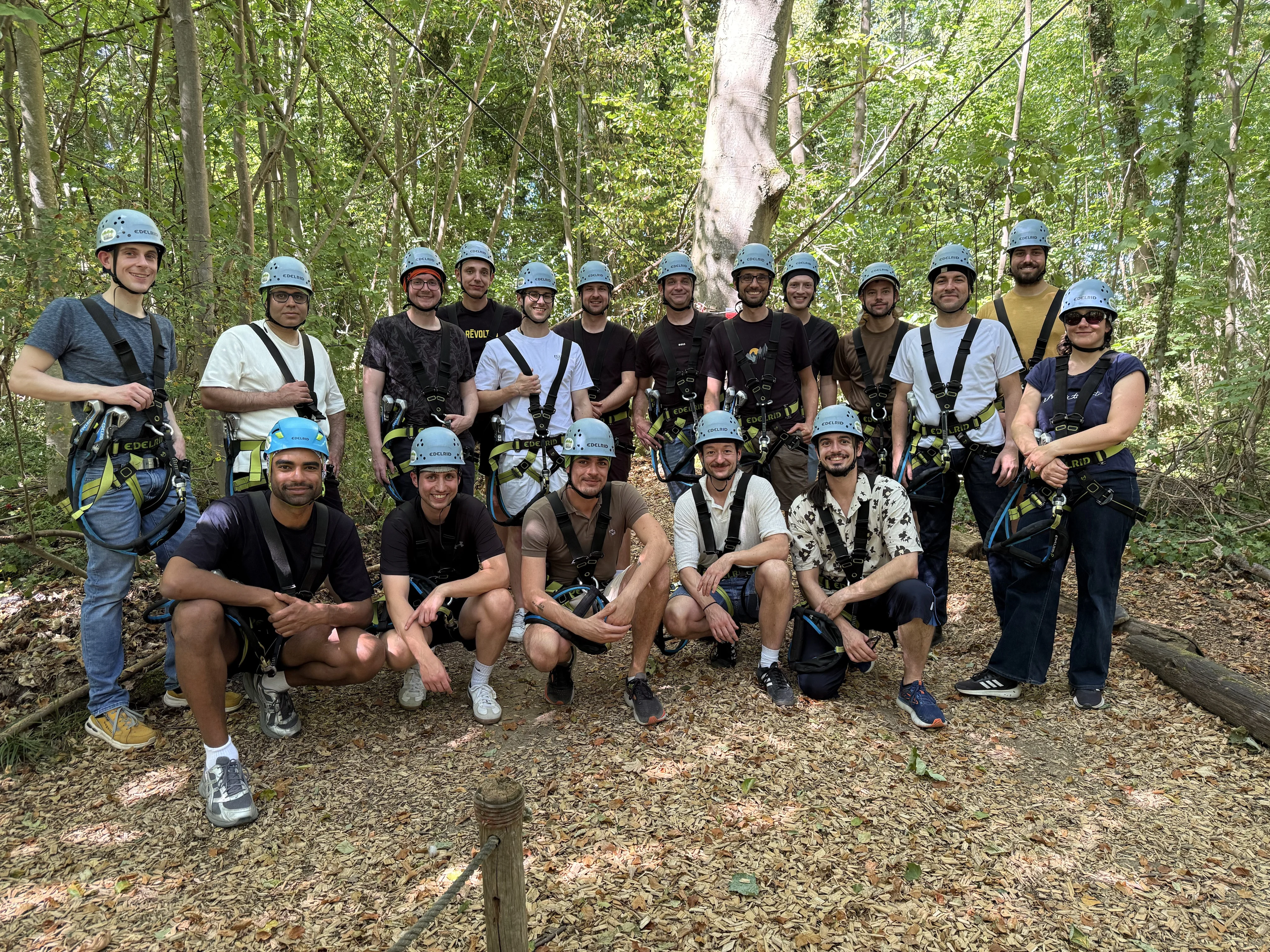 Group photo in climbing gear at the Turmberg forest ropes course