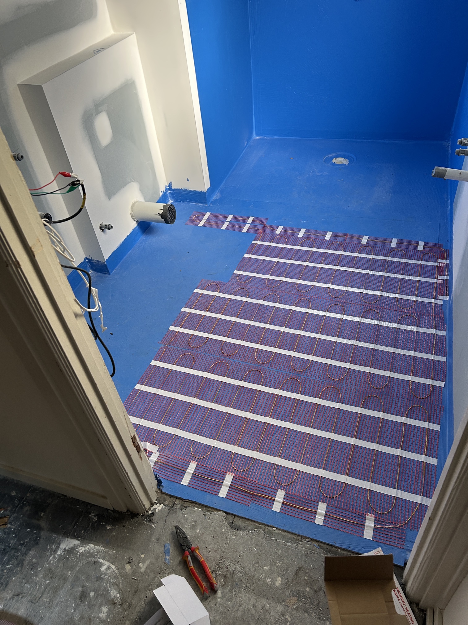 Underfloor heating installed in bathroom during full home renovation in South Yarra