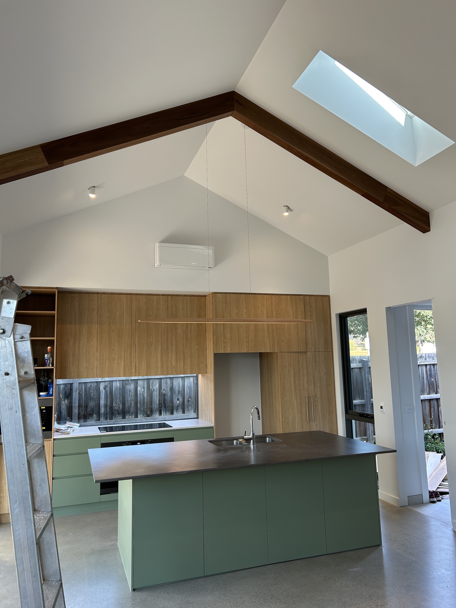 Kitchen renovation with custom pendant light installation on a pitched ceiling by Ferguson Electrical