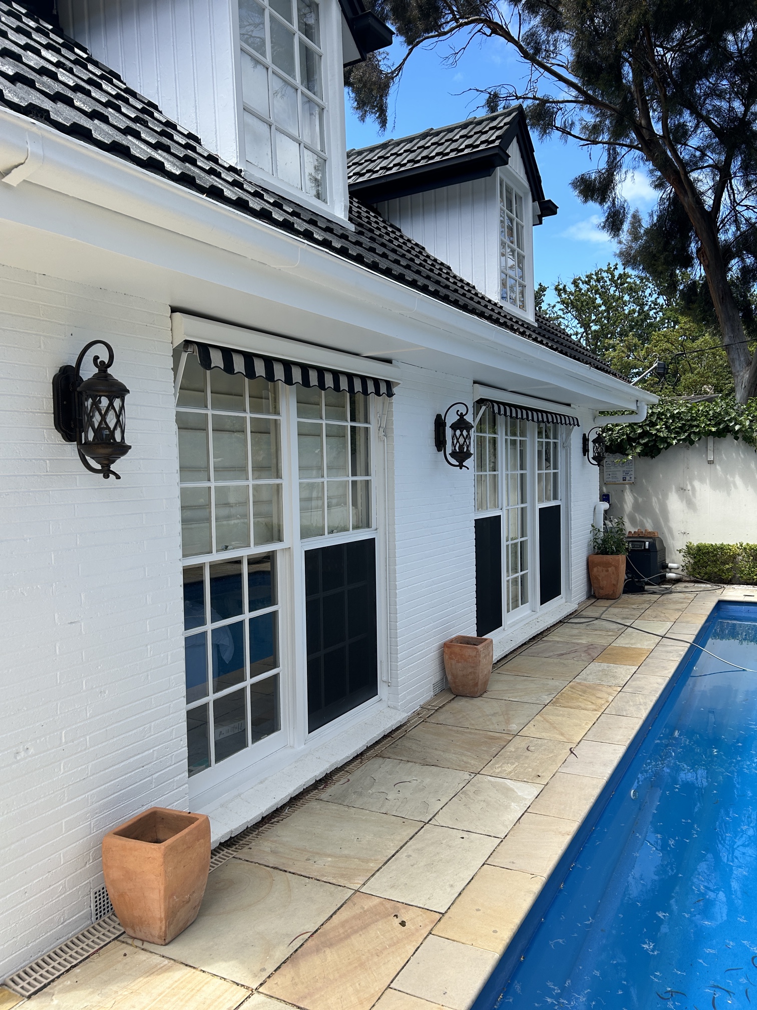 Outdoor wall lights installed by Ferguson Electrical at a renovated home in Cheltenham.