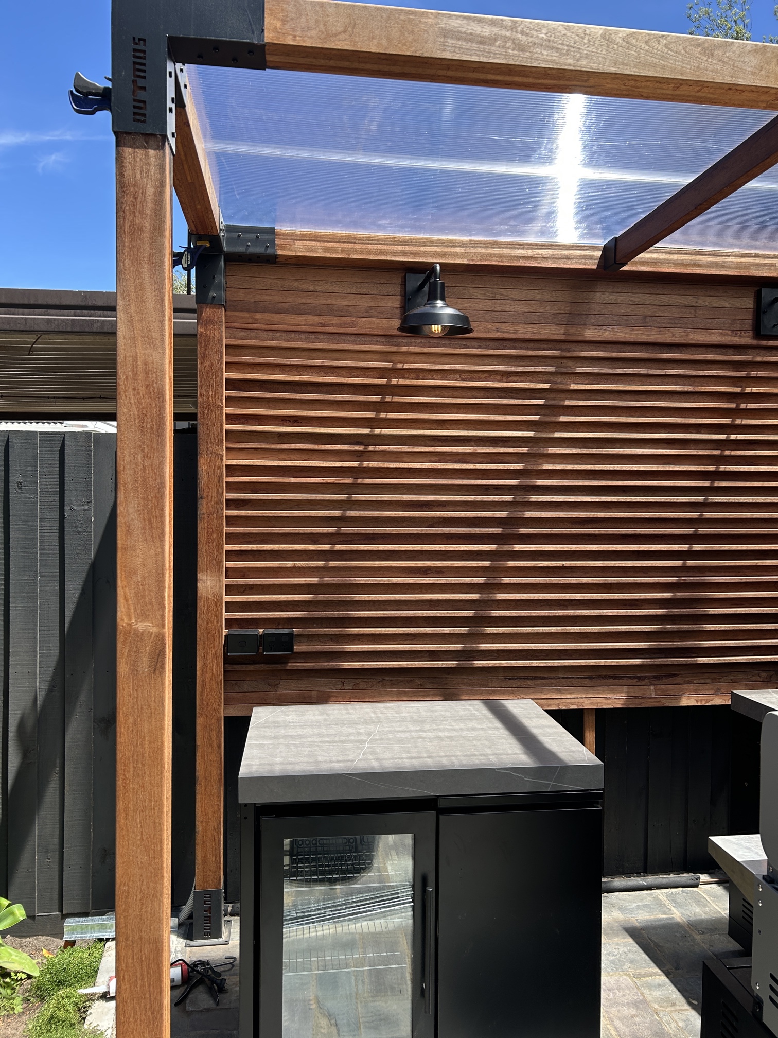 Outdoor kitchen and garden lighting installation in Kew by Ferguson Electrical