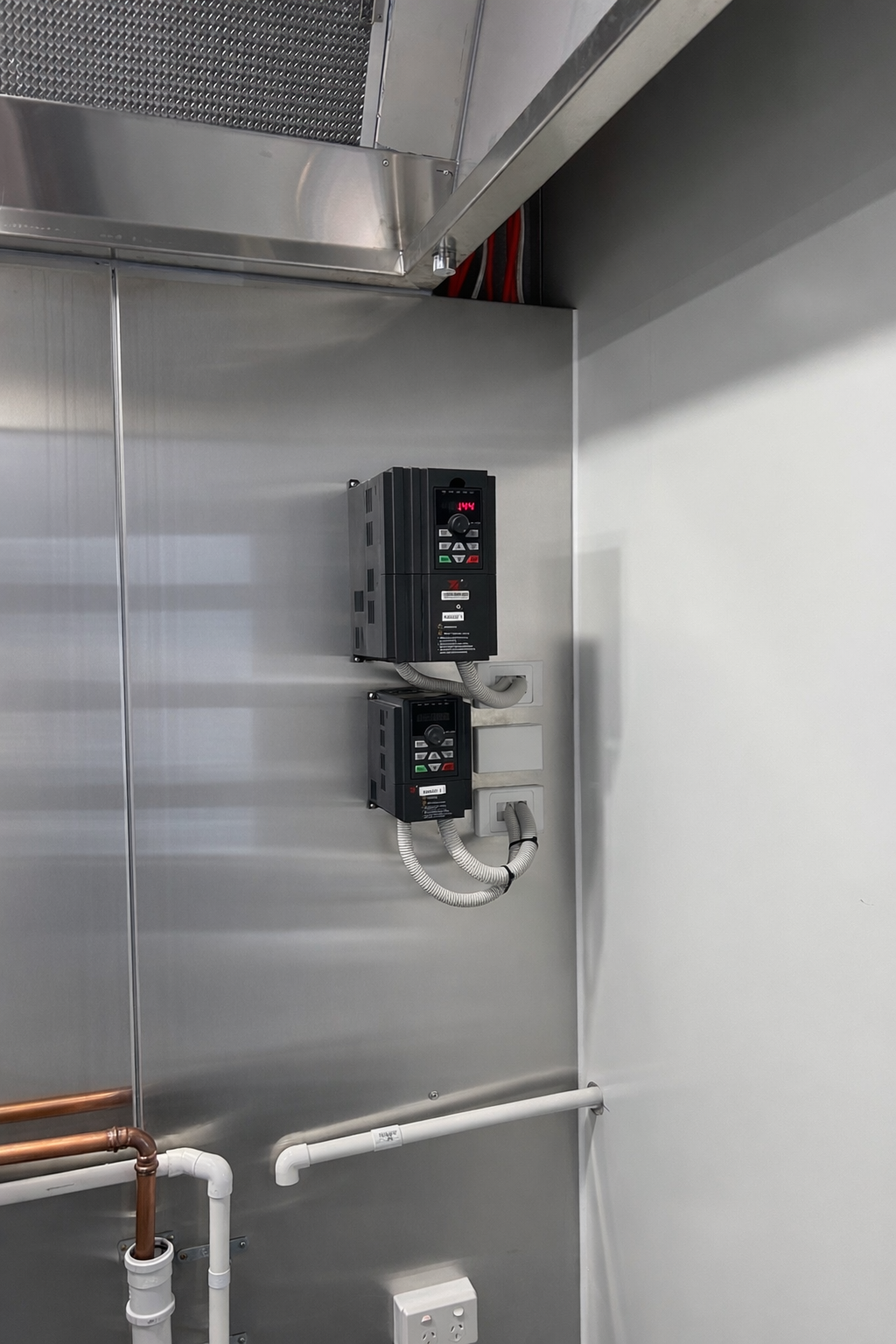 Commercial rangehood electrical installation with VFD motor controllers in a café kitchen fit-out in Pakenham