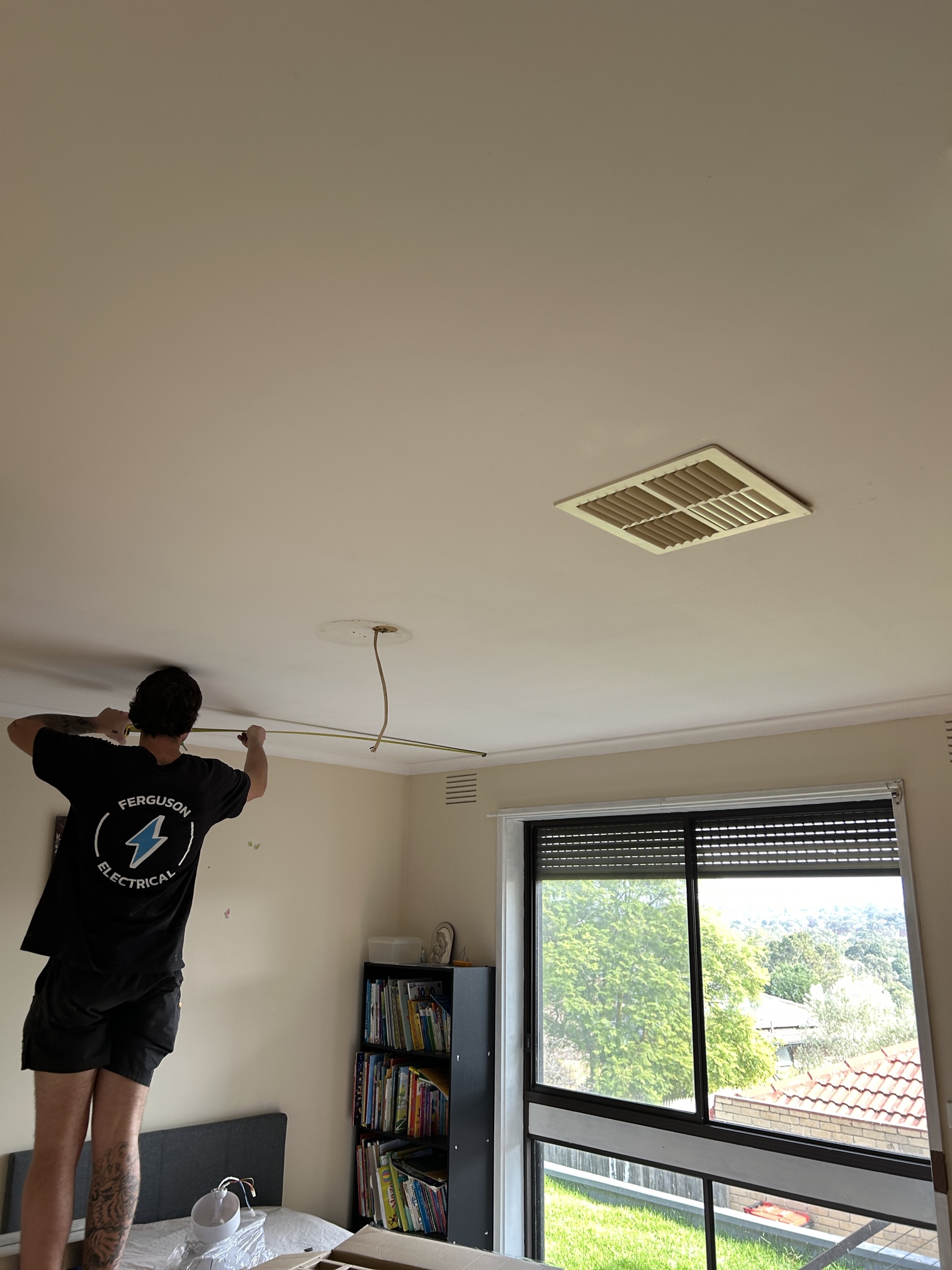 Electrician installing LED downlights and ceiling fans in Edithvale home upgrade