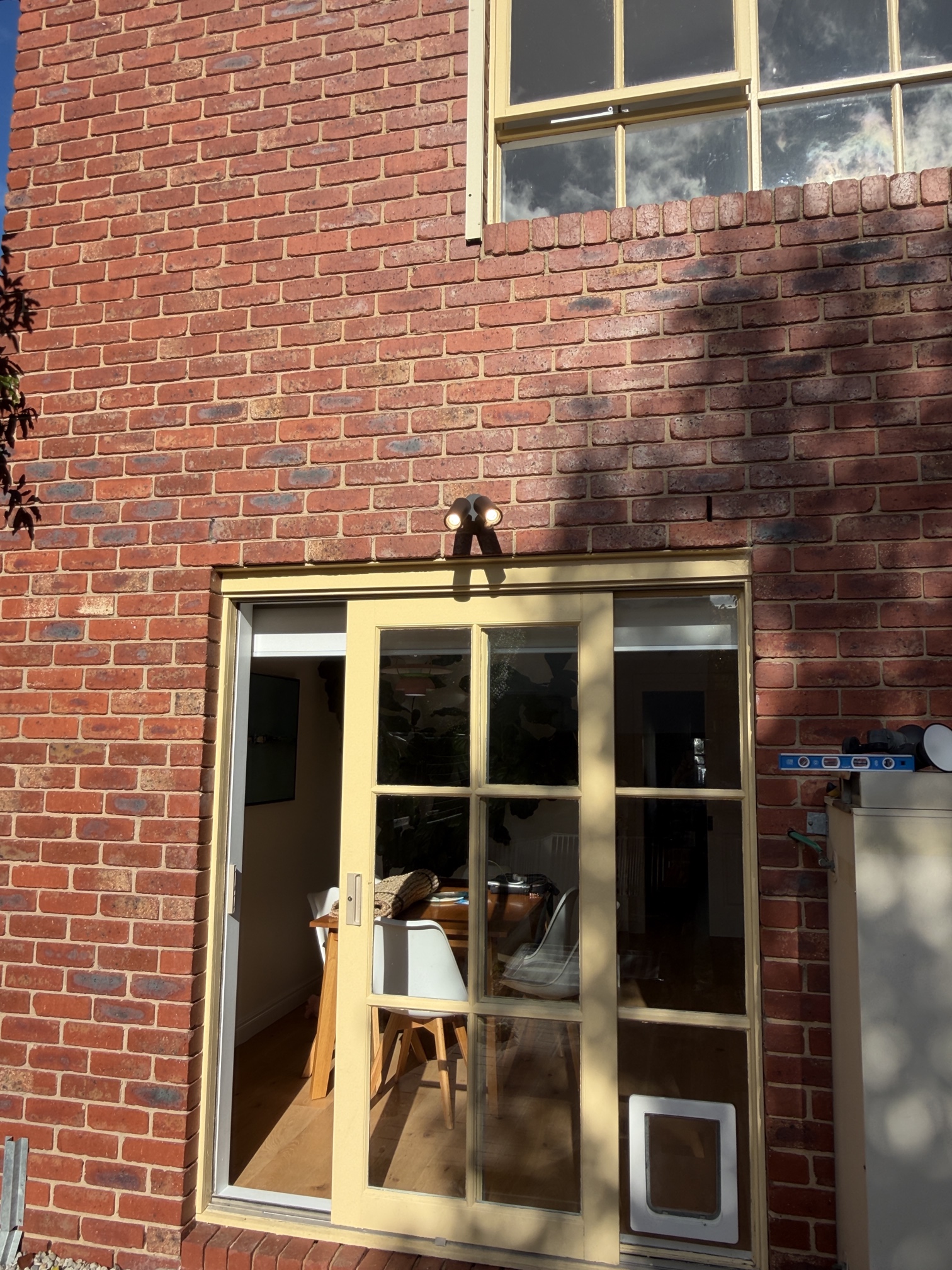 New LED outdoor spotlight installed above rear sliding doors at a residential home in Caulfield South by Ferguson Electrical.