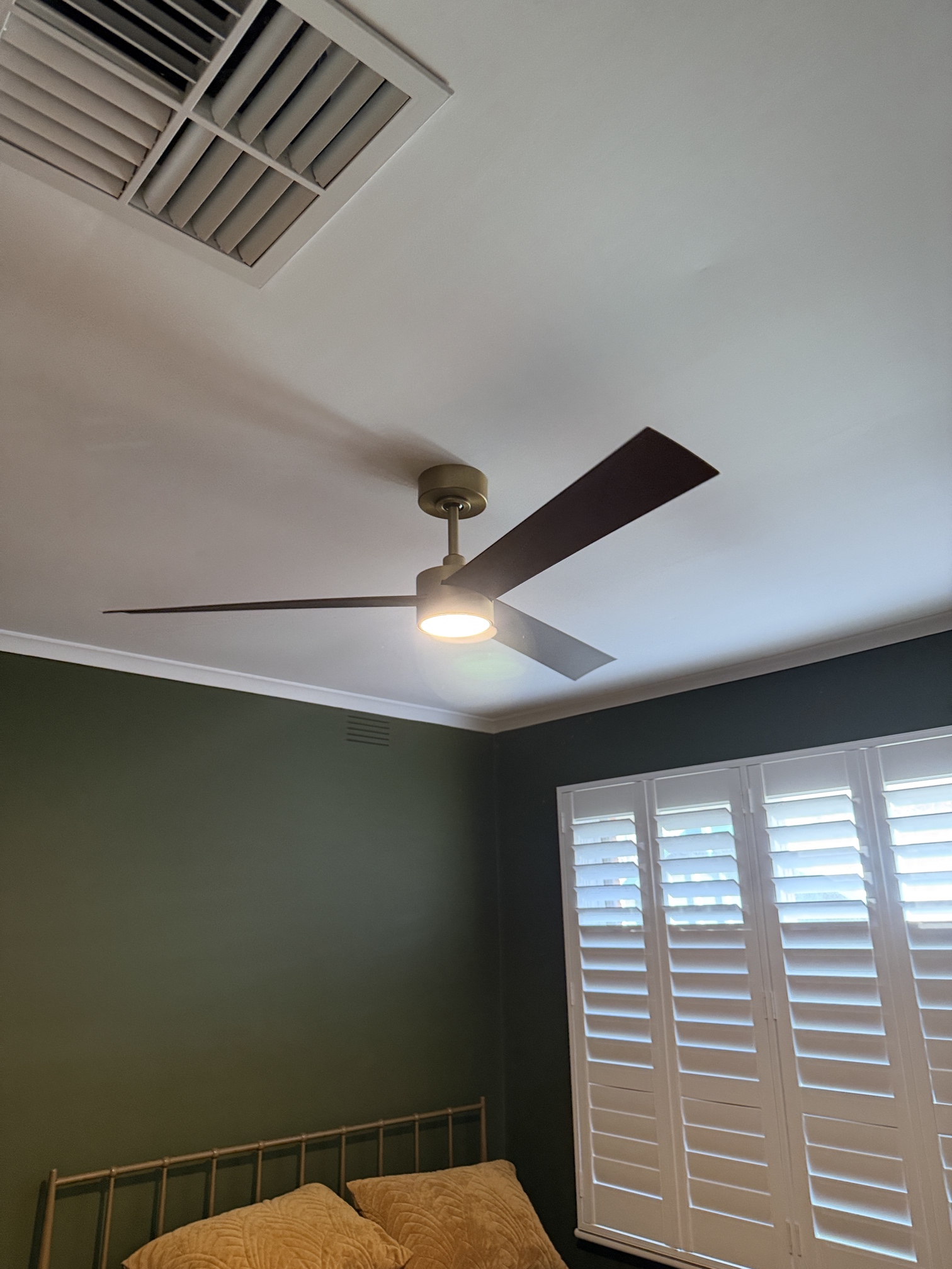 Modern black ceiling fan with integrated LED light installed by Ferguson Electrical during a home electrical upgrade in Aspendale, Victoria.