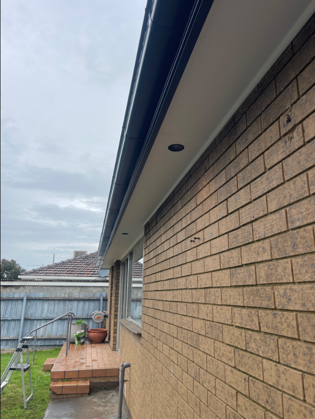 New LED downlight installed under the eave of a brick home in Chelsea Heights by Ferguson Electrical.