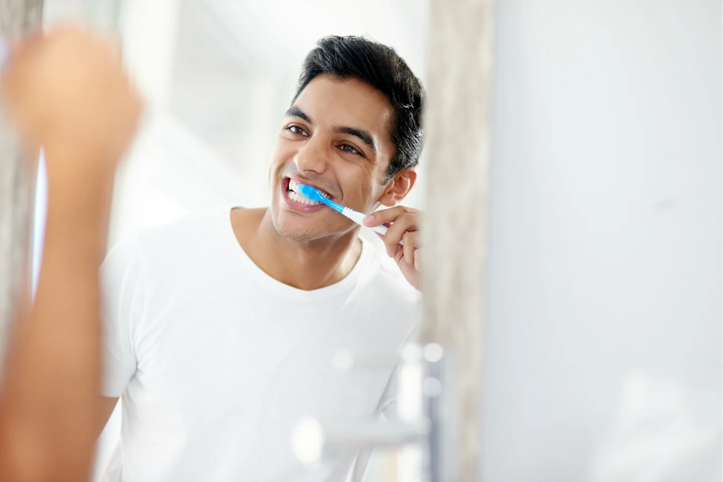 man brushing teeth