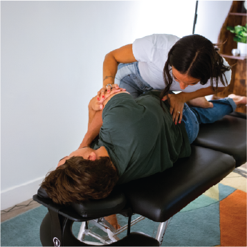Liv the chiropractor adjusting client