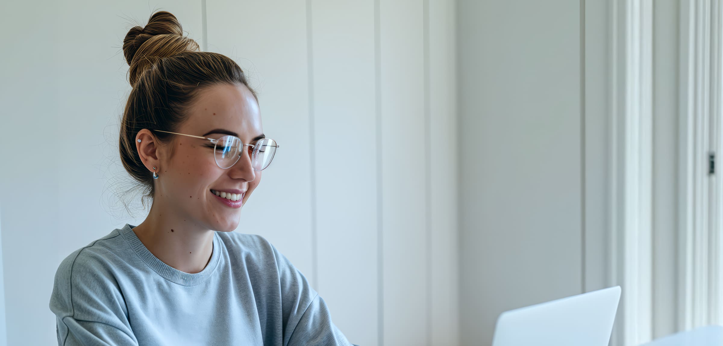 Woman typing at desk