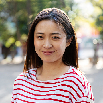 Young woman walking through neighborhood