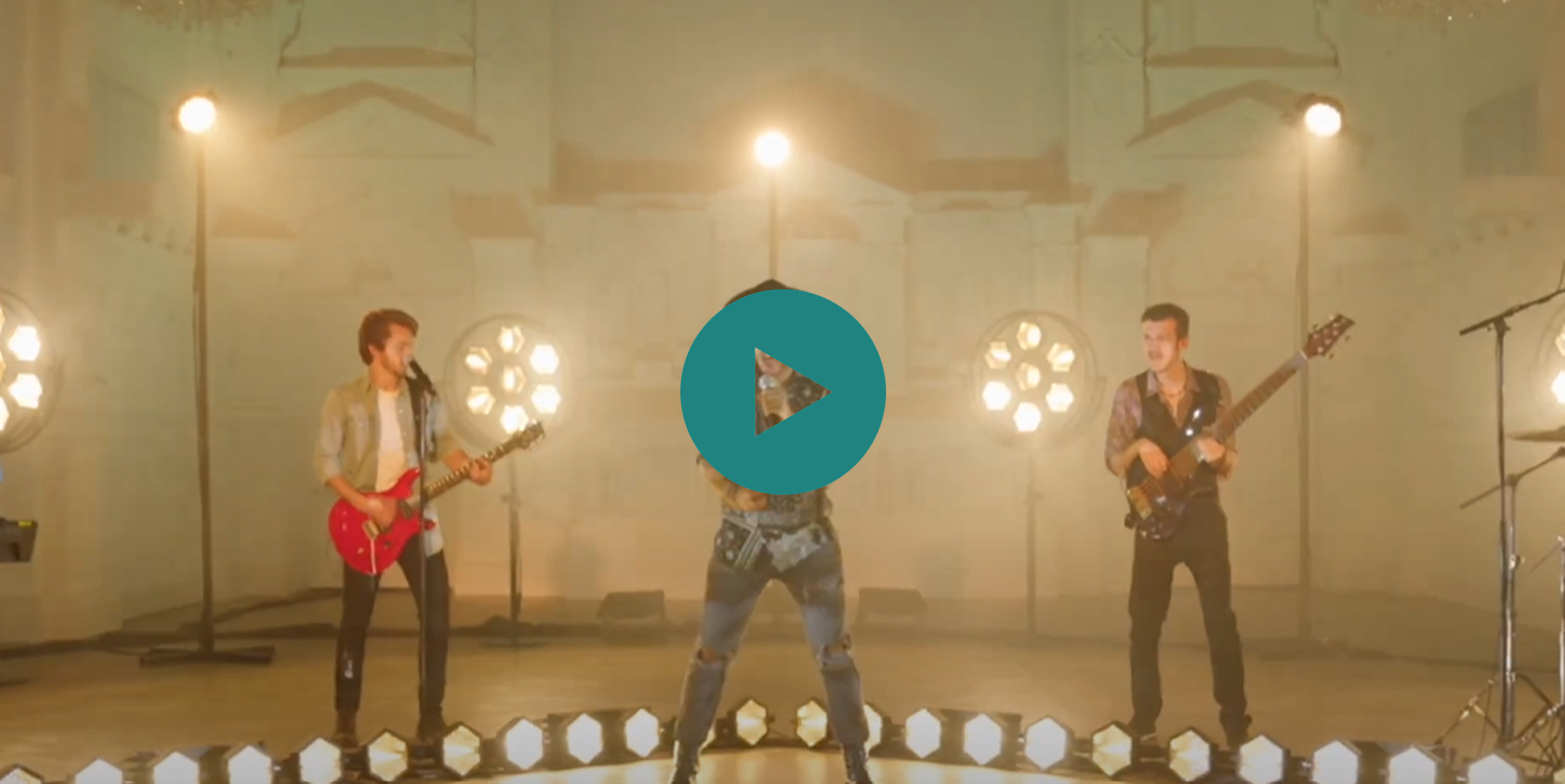 A group of three men playing instruments in front of a green video play button.