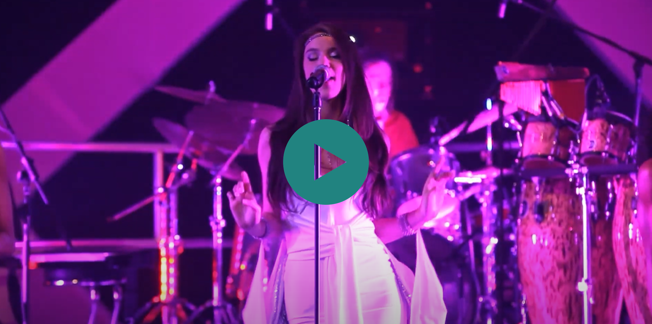 A woman singing into a microphone.