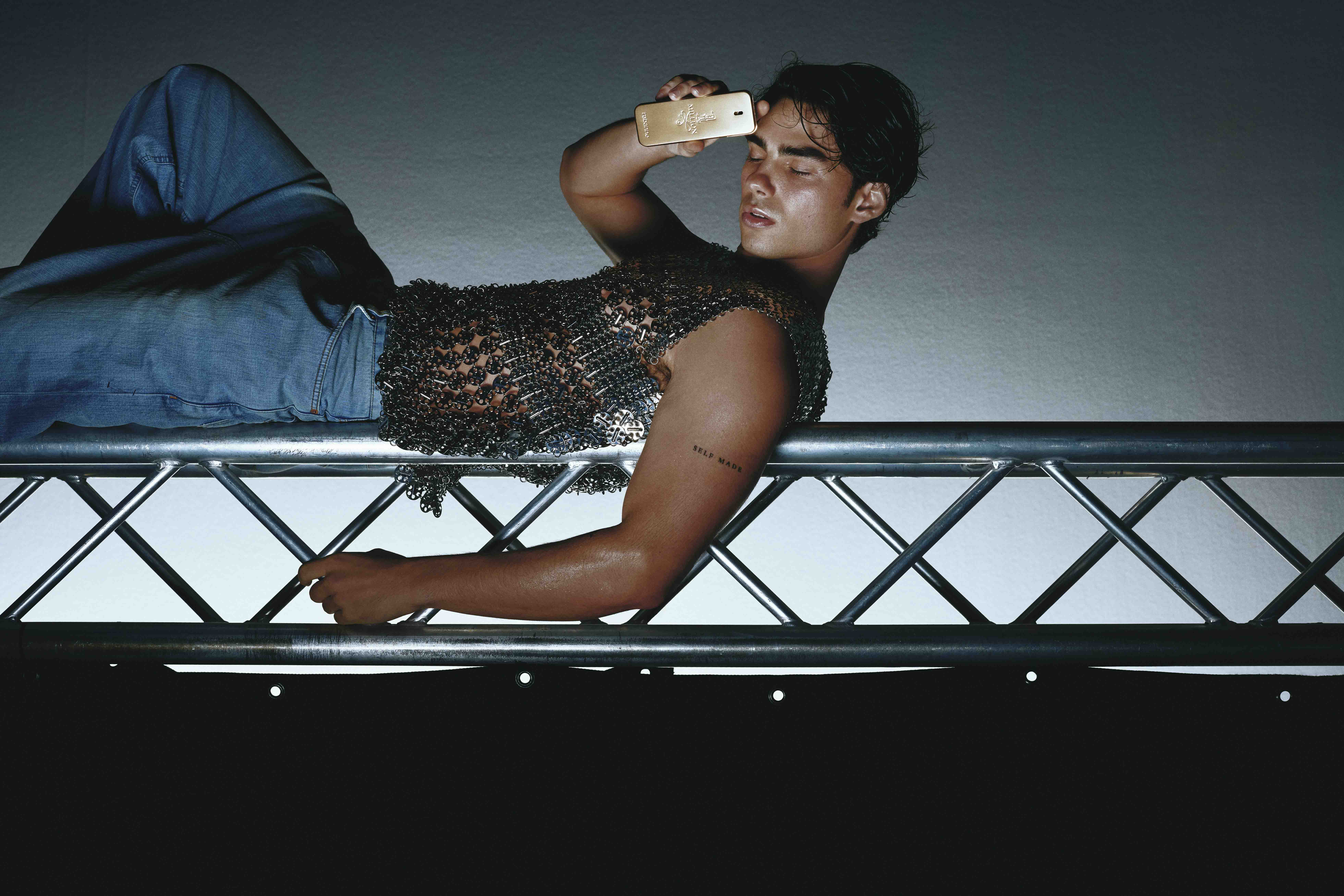 Artfully staged fashion image styled by Bianca Fleisch x Paco Rabanne showing the one million fragrance