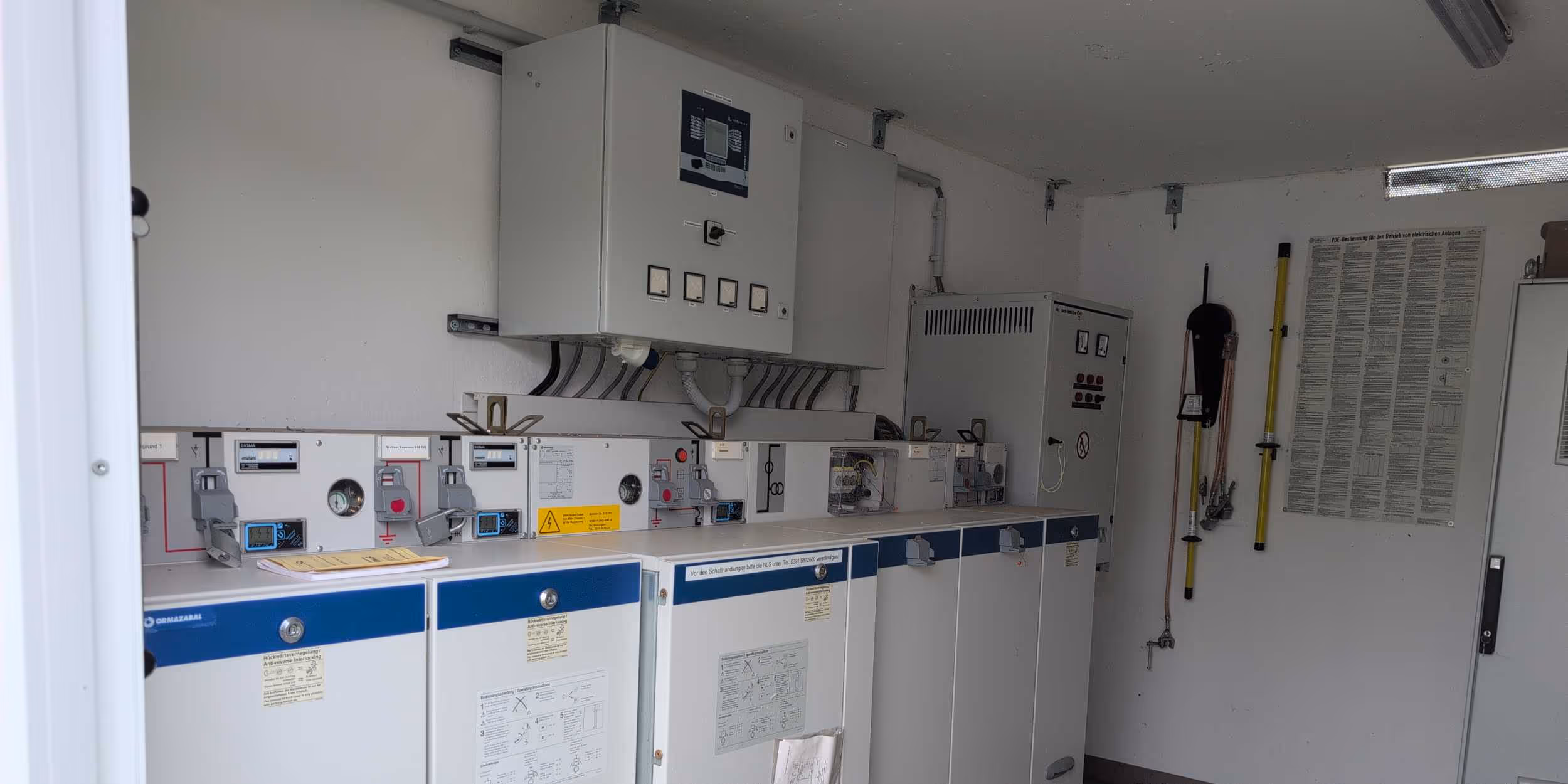 8.2 employee inspecting electrical operating room of battery