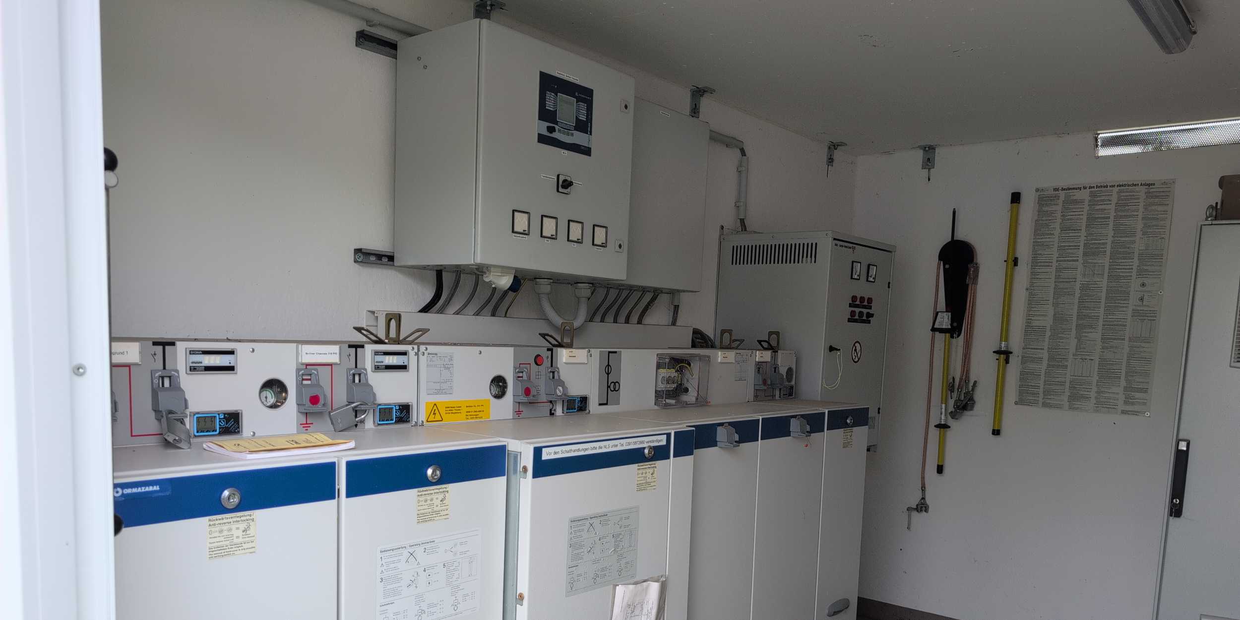 8.2 employee inspecting electrical operating room of battery