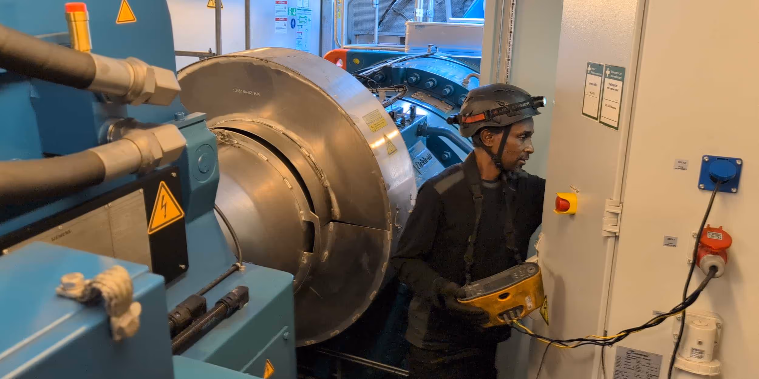 8.2 employee inspecting electrical operating room of a turbine