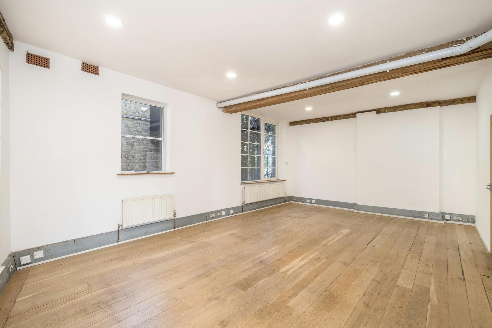 332802-1 Playhouse Court 64 SBR Live work rear room.jpg