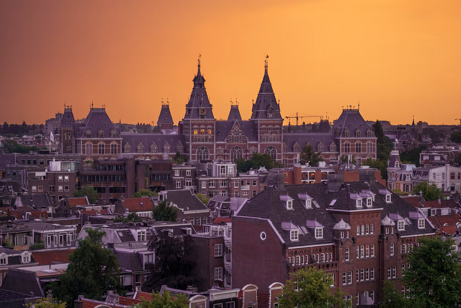 A beautiful sunset image of Amsterdam rooftops
