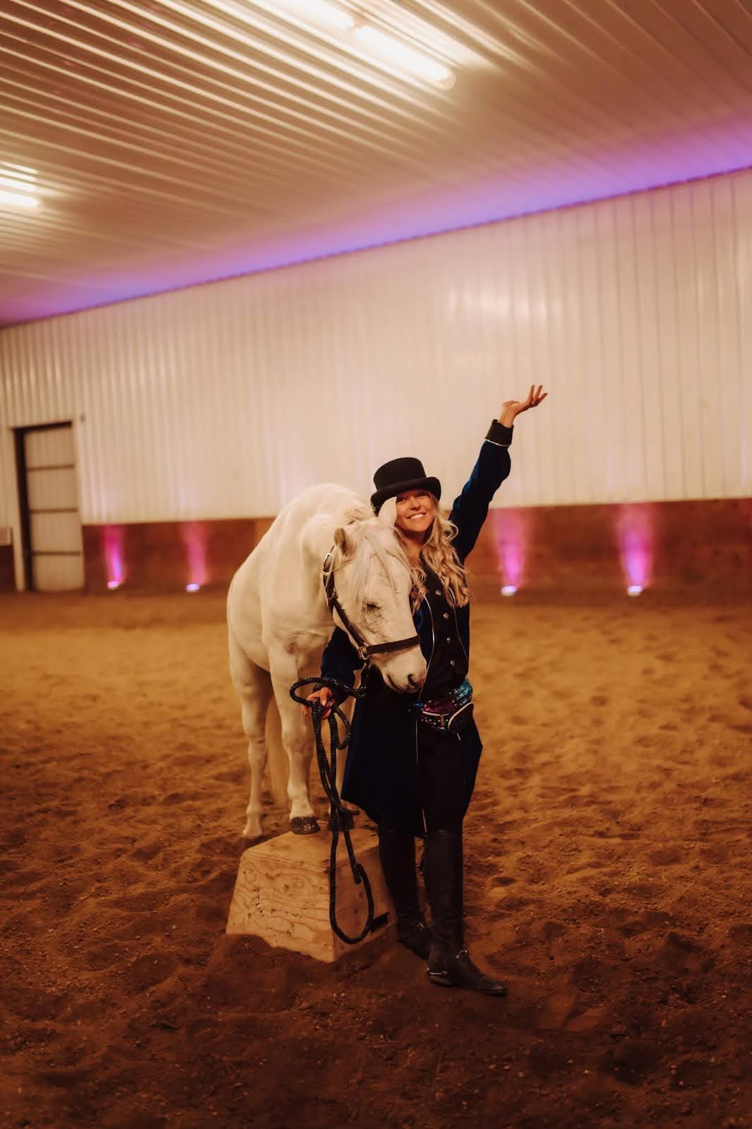A proud trainer and her pony after a performance.