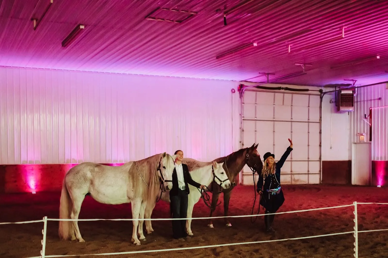 Two women with horses during a performance.
