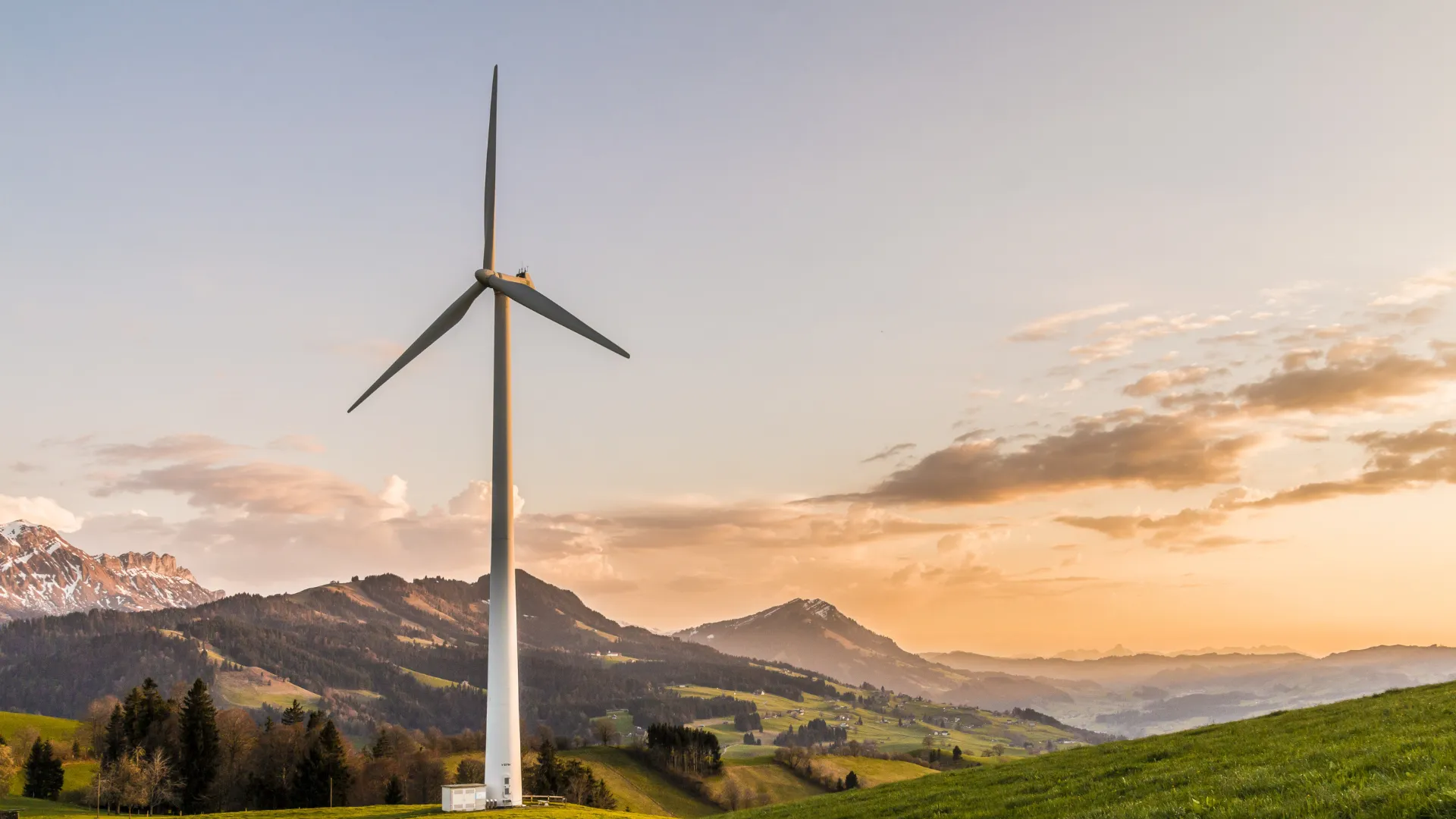 Wind turbines in a scenic Swiss landscape producing renewable energy