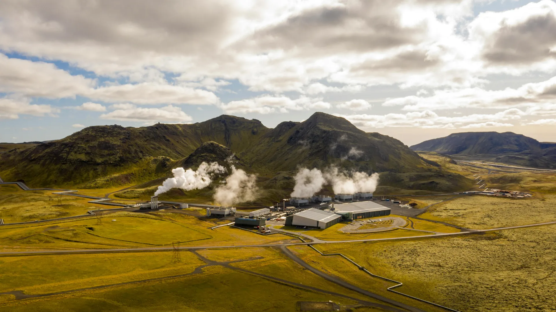 Active geothermal spring emitting heat and steam, illustrating renewable energy potential
