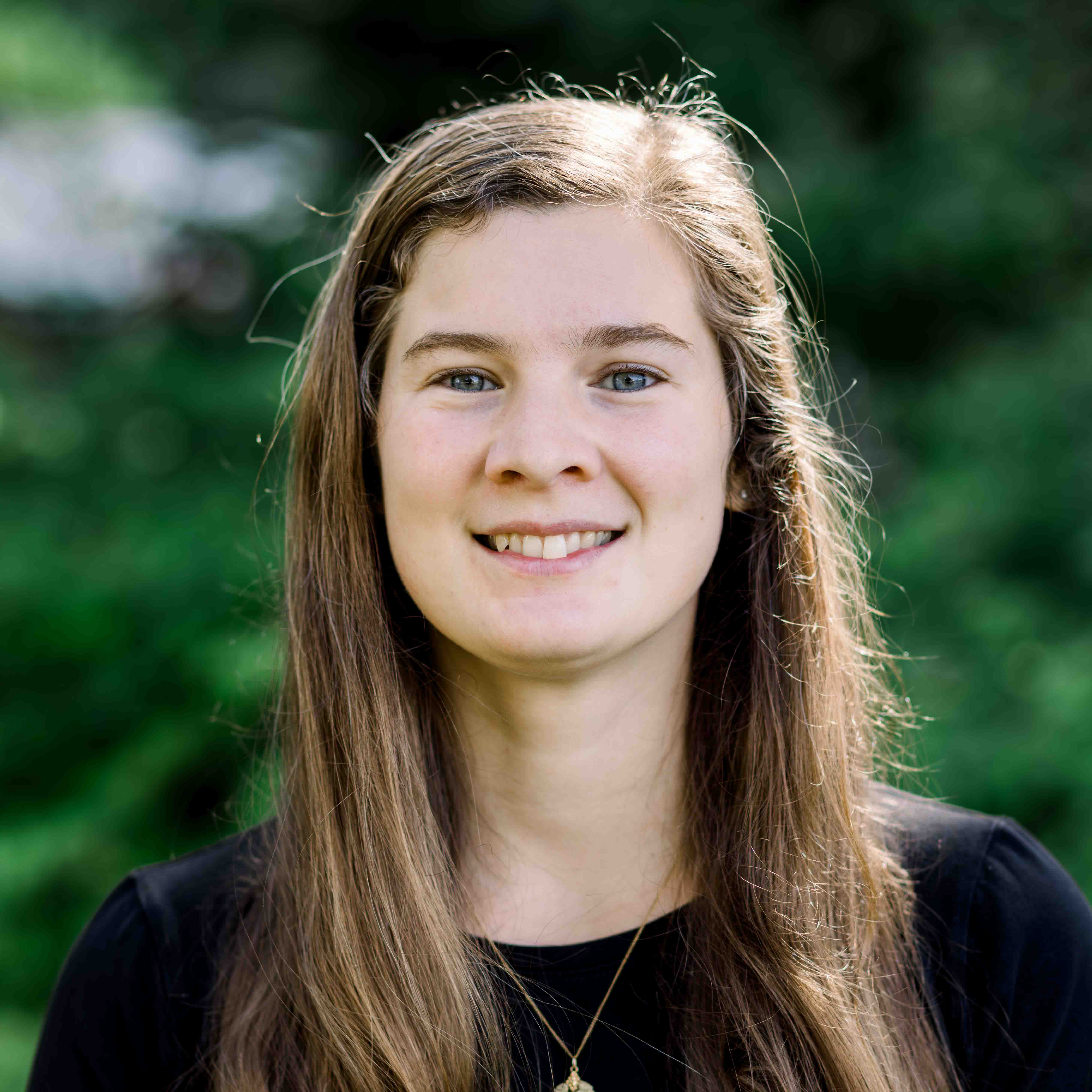 Outdoor headshot of girl's varsity soccer coach, Kirsten Bouchoc