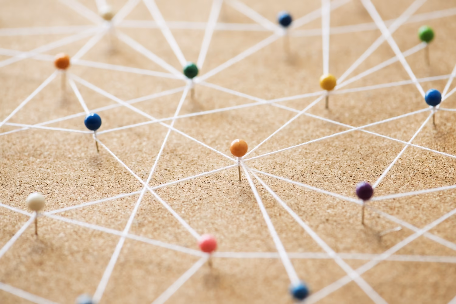 Push pins connected by lines forming a network