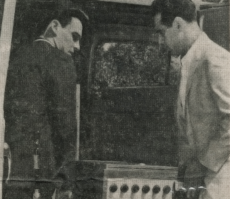 Roy and Gene Clair loading audio equipment into a van